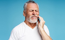 An older man suffering a toothache